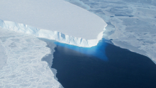 An ice cliff above the ocean adjacent to Thwaites Glacier in West Antarctica. Credits: NASA Public domain, via Wikimedia Commons.